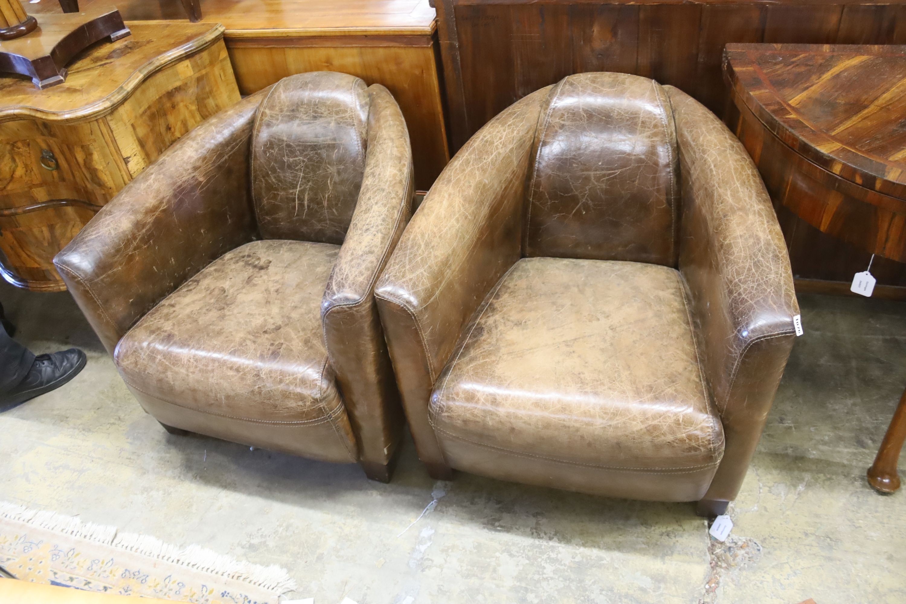 A pair of contemporary brown leather club chairs, in the Art Deco style, width 72cm, depth 80cm, height 65cm